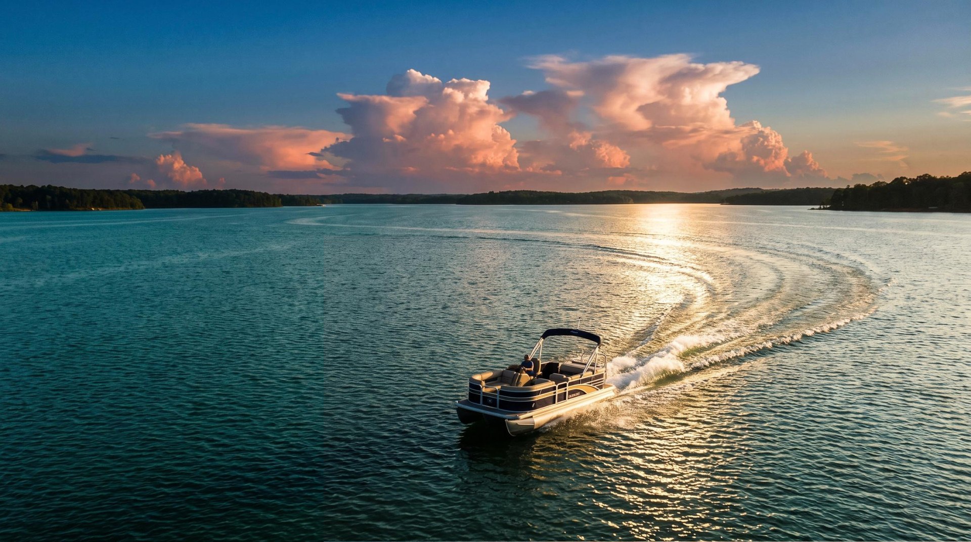 A pontoon boat running across Lake Wateree at golden hour